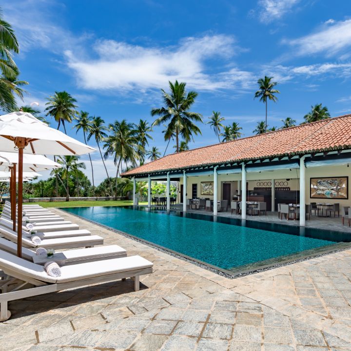 Pool and sun decks at a luxury villa in Bentota by Taru Villas