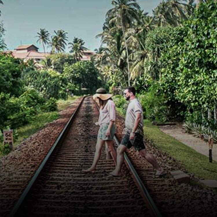 Couple crossing the railway tracks