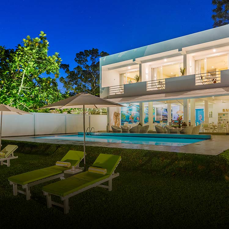 Exterior of Tangalle Social with Pool at night 