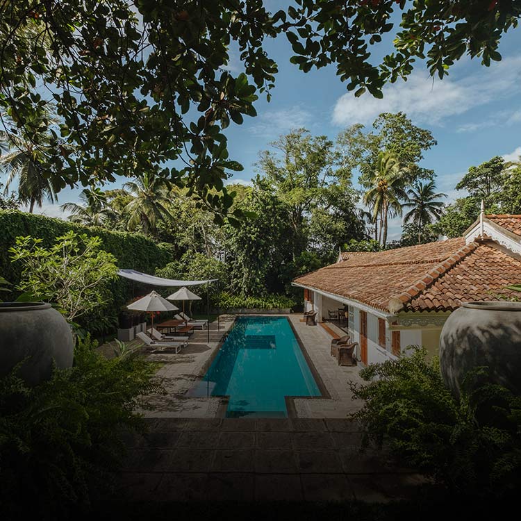 View of pool area at Leela Walauwwa by Taru Villas